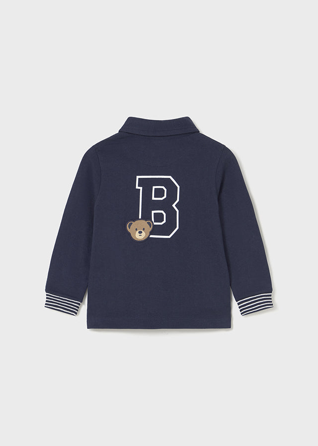 Polo à manches longues bleu avec broderies