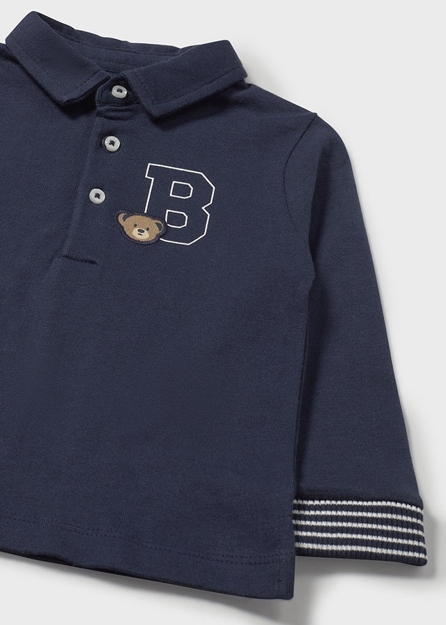 Polo à manches longues bleu avec broderies