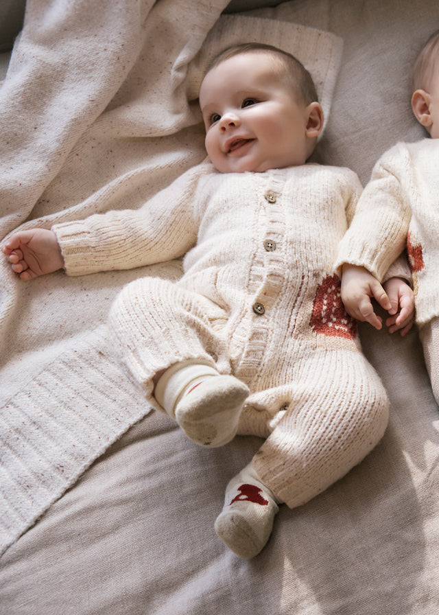 Romper à manches longues avec escargot en tricot