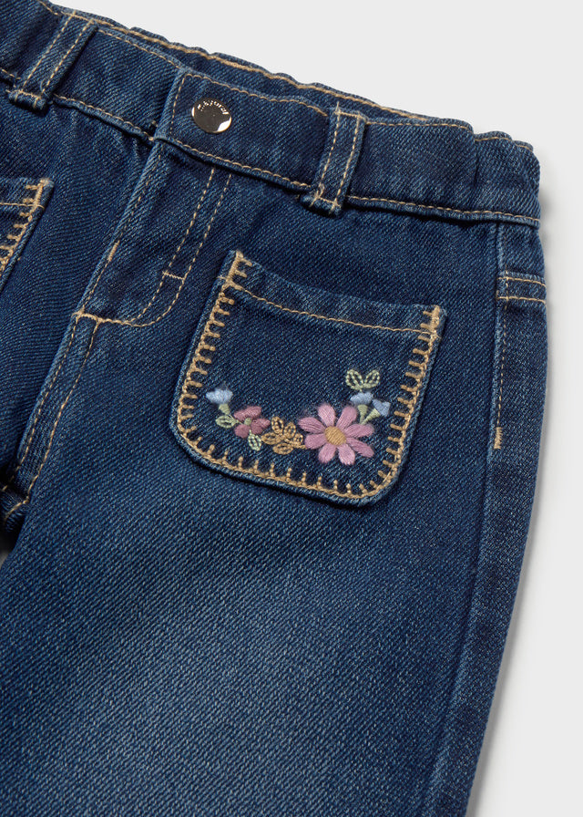 Pantalon en denim foncé avec poches brodées