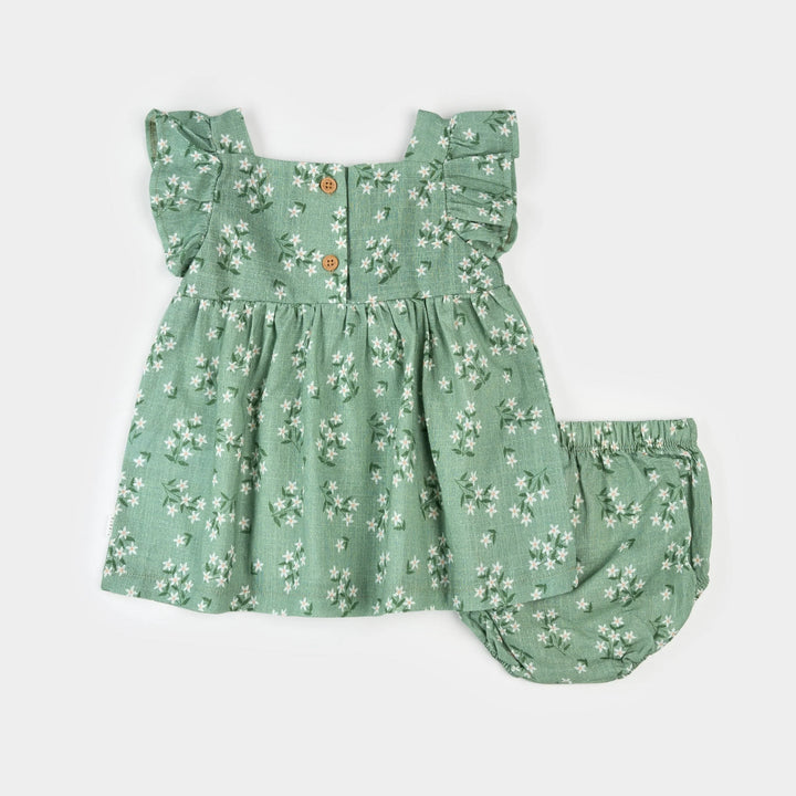 Robe verte à imprimé de fleurs exotiques