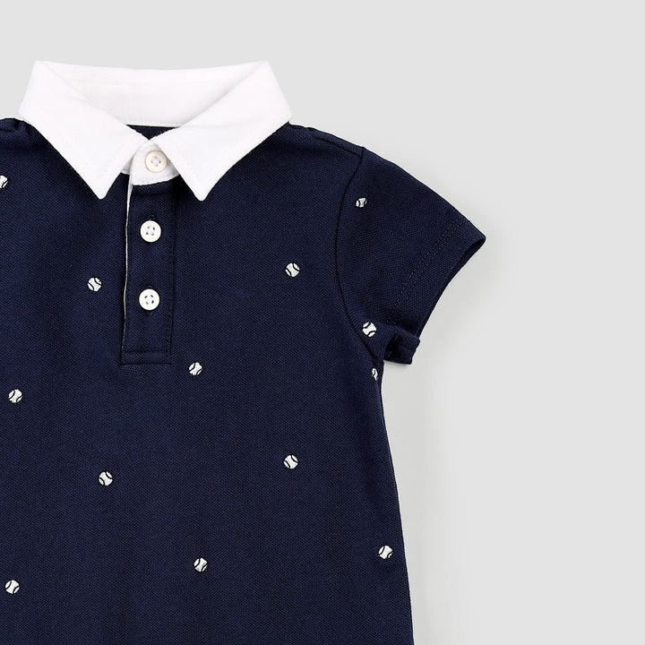 Romper polo bleu marine avec balles de tennis brodées