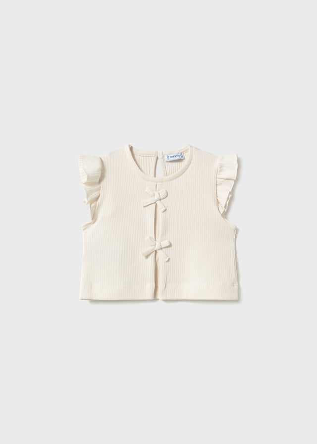 Gilet en tricot blanc à boucles