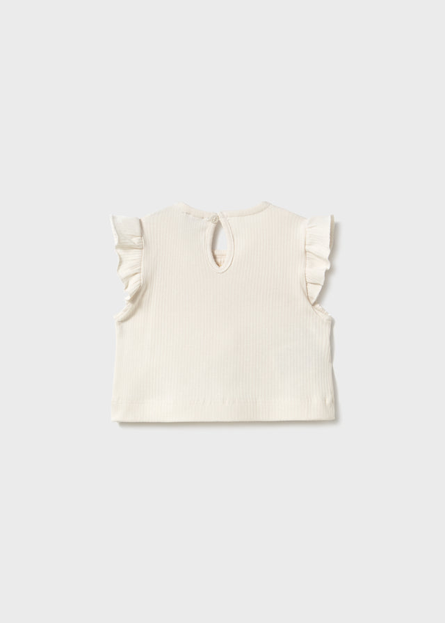 Gilet en tricot blanc à boucles