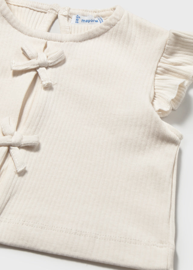 Gilet en tricot blanc à boucles