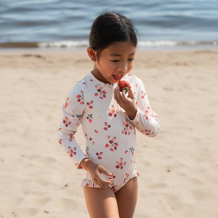 One-piece swimsuit with long sleeves and strawberry print