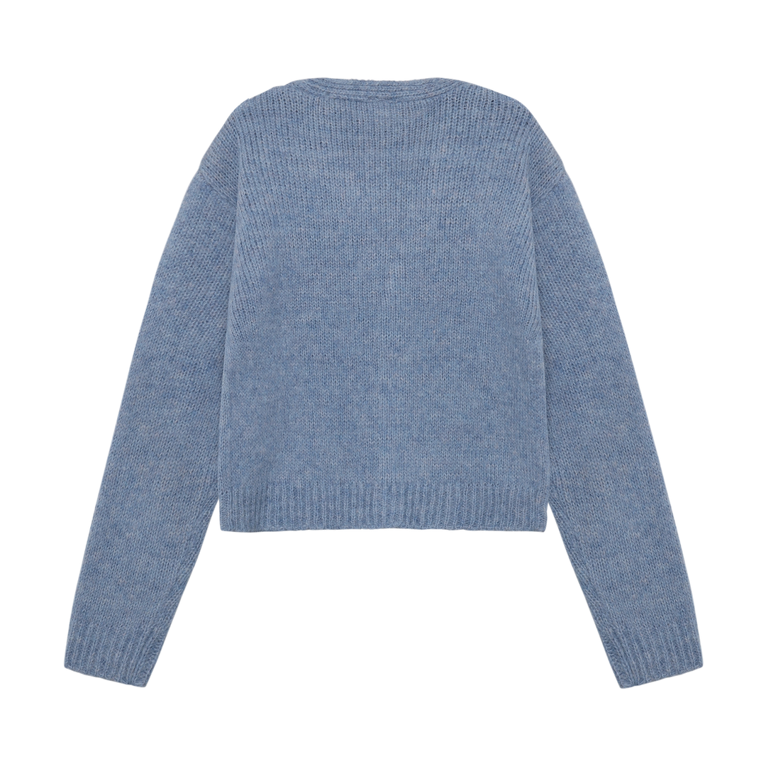 Cardigan en tricot bleu avec fleurs
