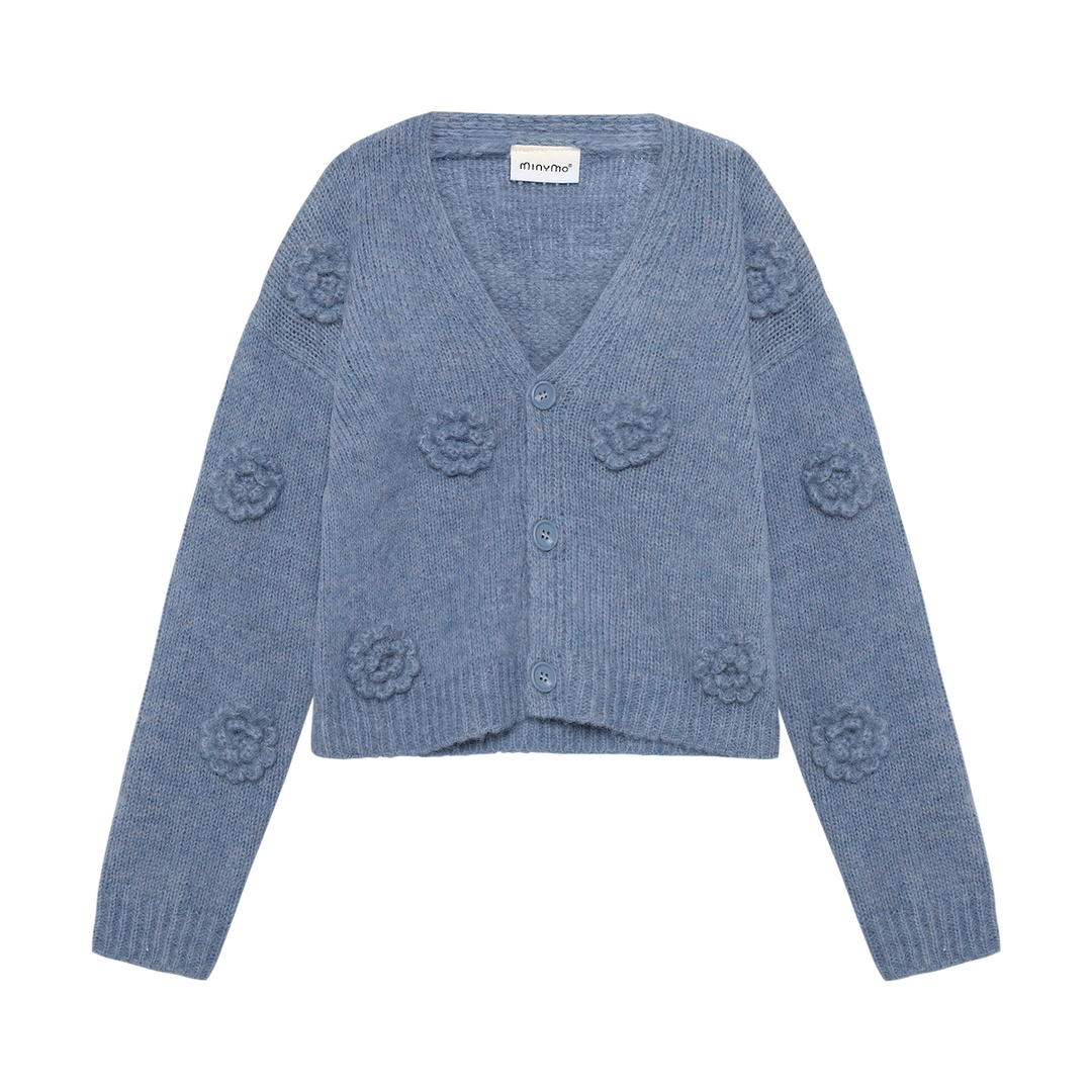 Cardigan en tricot bleu avec fleurs