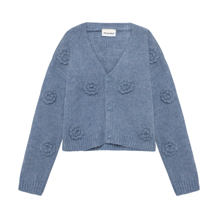 Cardigan en tricot bleu avec fleurs