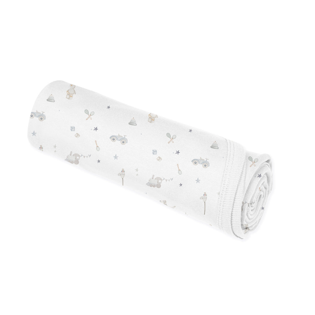 Couverture en modal - Jouets sur fond crème
