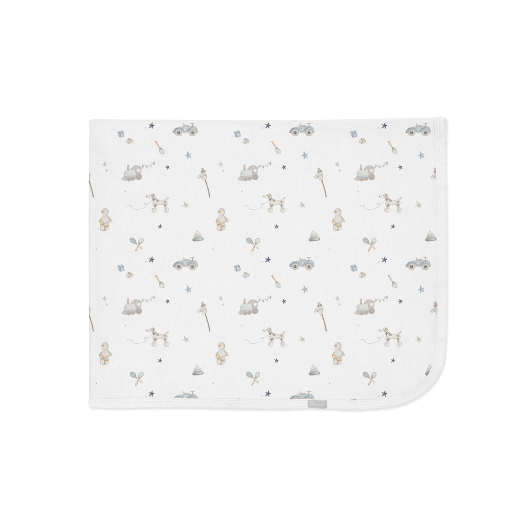 Couverture en modal - Jouets sur fond crème